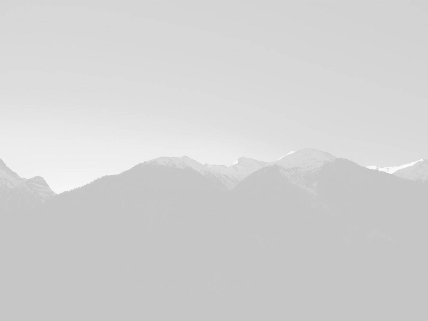 A black and white photo of a mountain range.