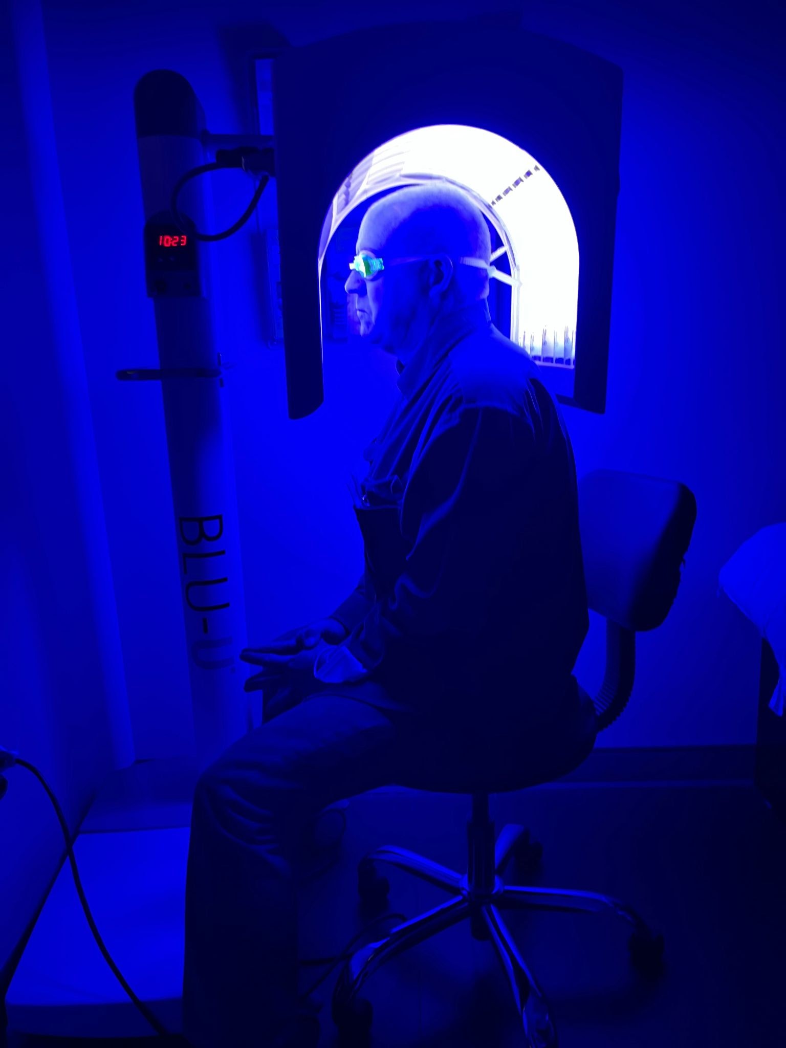 The blue light treatment of a person